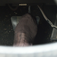 driving in brown sheer socked feet